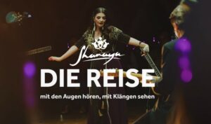 Aufnahme einer Tänzerin, davor der Schriftzug der Band Shanaya.